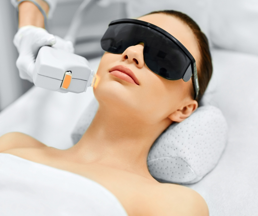 Young Woman Receiving Facial Beauty Treatment