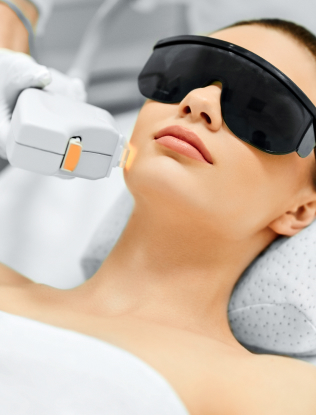 Young Woman Receiving Facial Beauty Treatment