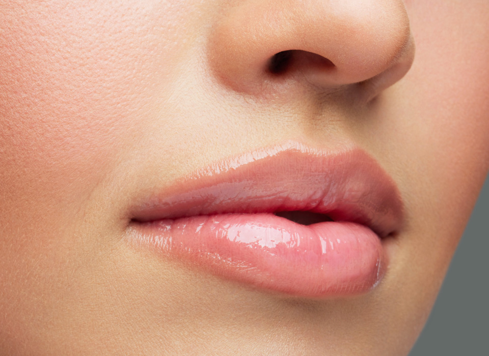 Close-up face of beauty young woman - lips make-up zone