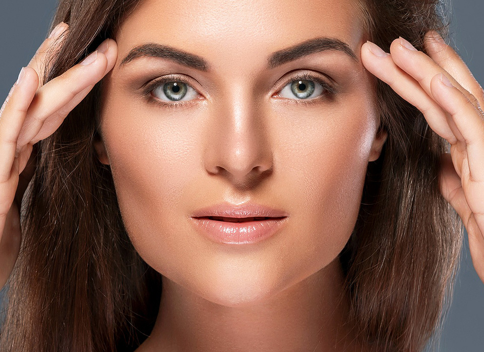 Close-up beauty face of young caucasian model girl with clean skin